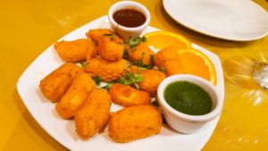 a photo of Handi Cuisine's paneer pakoras which is cottage cheese battered with Indian spices and deep fried