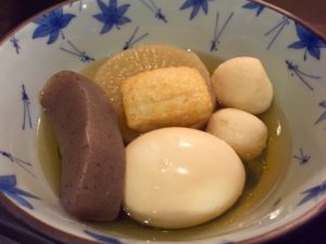 a bowl of homemade oden with fish balls and white radish and more on rice