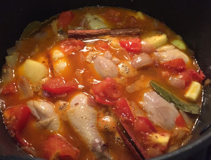 One pot cooking Southern Spiced Chicken Stew simmer at low heat